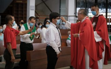 Sixteen students receive the Sacrament of Confirmation