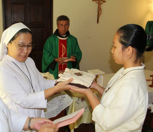 Rite of Entry to Novitiate: Postulants Emilianie Usun Remy and Felicia Binti Bunut