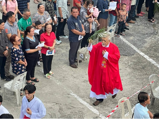 Rev. Fr Joseph Chai leads the faithful of OLQP Sri Aman in our Palm Sunday procession—from the Shrine to the sanctuary—as we wave our "Hosannas" to Christ our Saviour (Mark 11:9).