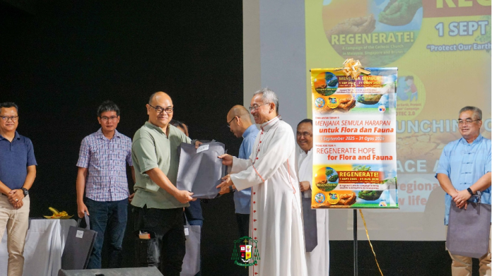 Archbishop Simon Poh presents the PROTEC 2.0 campaign kit to Fr Lazarus Swinnie