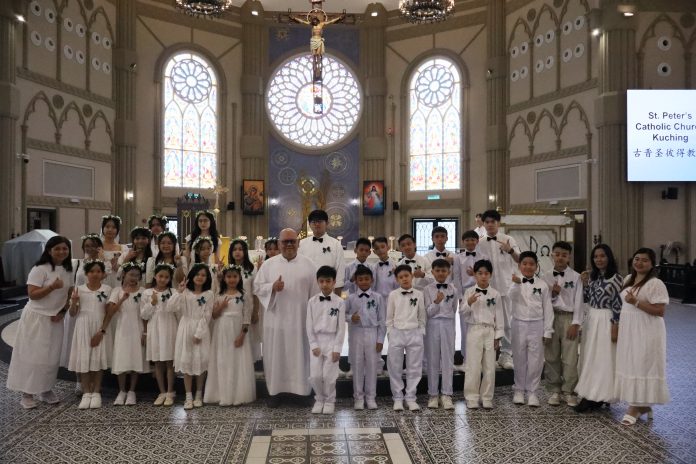 1st Holy Communion: St Peter’s Church confirmands with Fr Mark Bunchol.